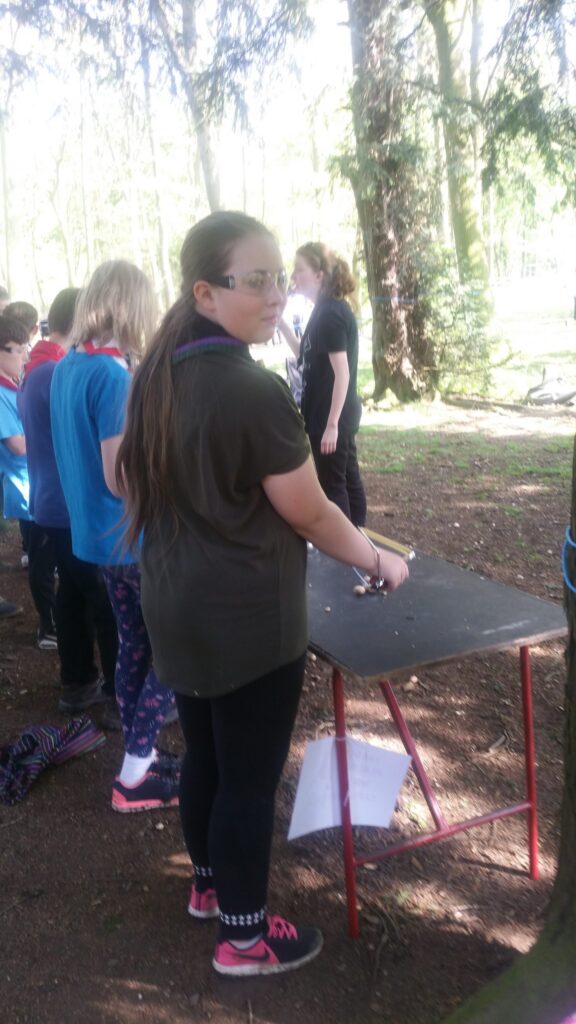 Young people taking part in an outdoor target activity.